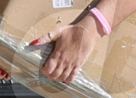 A ringless Tori Spelling is seen unloading boxes in the street before carrying them into a private residence in rural Los Angeles.