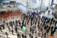 Commuters stop for the two minute silence for the fallen heroes of World War One on Armistice Day at Waterloo Station, London.