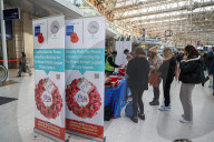 Commuters stop for the two minute silence for the fallen heroes of World War One on Armistice Day at Waterloo Station, London.