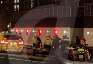 Armed Police detain soemone outside  the House of Commons