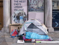 A homeless person sets up a tent on Regent Street