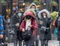 Christmas shoppers in face masks in London’s West End. 