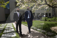 Opposition leader Anthony Albanese and shadow minister Chris Bowen leave a press conference in Parliament House.