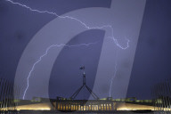 Lightning strikes around the flag pole at Parliament House during a thunderstorm in late September.