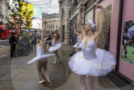 Ballet dancers and Christmas shoppers