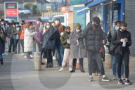 Vaccination queue at the Cullimore Pharmacy in North London 