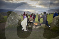 Winter solstice 2021 celebrations. Dawn at Castlerigg stone circle near Keswick, Cumbria.  Revellers in England and Ireland mark the shortest day of the year and official first day of winter.