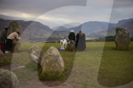 Winter solstice 2021 celebrations. Dawn at Castlerigg stone circle near Keswick, Cumbria.  Revellers in England and Ireland mark the shortest day of the year and official first day of winter.