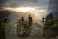 Winter solstice 2021 celebrations. Dawn at Castlerigg stone circle near Keswick, Cumbria.  Revellers in England and Ireland mark the shortest day of the year and official first day of winter.
