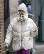 Members of the public brave the rain while shopping London.