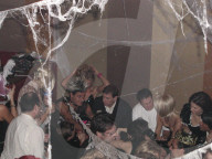 Prince Andrew is seen standing amongst a group of revelers at a Hookers and Pimps-themed Halloween party held in New York in October 2000