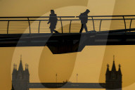 Commuters at sunrise on a cold day in London, UK.