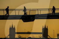 Commuters at sunrise on a cold day in London, UK.