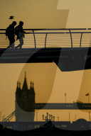 Commuters at sunrise on a cold day in London, UK.