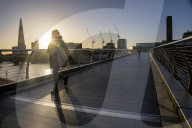 Commuters at sunrise on a cold day in London, UK.