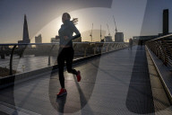 Commuters at sunrise on a cold day in London, UK.