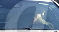 Britney Spears goes to extreme measures to stay out of sight as she covers her head with a blanket whilst driving around the San Fernando Valley on Wednesday morning. 