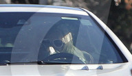 Britney Spears goes to extreme measures to stay out of sight as she covers her head with a blanket whilst driving around the San Fernando Valley on Wednesday morning. 