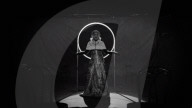 Adele channels a religious look and reveals tiny waist in a teaser trailer for new video