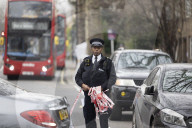 Arrest made after woman stabbed to death and man killed by car in London.