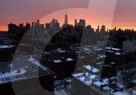 FEATURE -  Sonnenuntergang nach einem Schneesturm in New York City