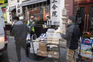 China Town receive their food deliveries ahead of the Chinese New Year celebrations, London.