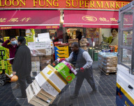China Town receive their food deliveries ahead of the Chinese New Year celebrations, London.