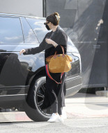 PREMIUM EXCLUSIVE Katherine Schwarzenegger Hides Growing Baby bump Beneath Long Black Overcoat