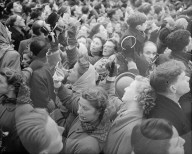 KING'S FUNERAL ... 15.2.52.  PHOTO SHOWS: A section of the huge crowd near Marlborough House, some of whom had little chance of seeing the procession, are using hand mirrors to see over the heads of the crowd in front.