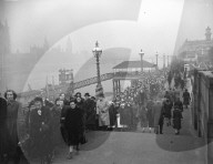 THE HOMAGE QUEUE STRETCHES FOR MILES  13-2-52  The great queue of people waiting to file  past the catalalque in London's Westminster  Hall, where King George Vi is. lying in state,  now stretches for miles, it is six, and in some  parts, 10 deep. It star