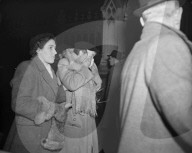 THE WEEPING WOMAN CAME FROM WINDSOR    11-2-52  PHOTO SHOWS:- An elderly woman, who was one of a party of workers from Windsor Castle and estates, is seen weeping outside Westminster Hall, London, tonight  where King George Vi is now lying-in-state. 
11 