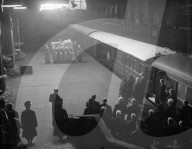 KING'S COFFIN ARRIVES IN LONDON          11-2-52          The scene at London's King's Cross Station this afternoon when the King's coffin arrived by train from Wolferton after the Sandringham procession. On the coffin rests the Imperial State Crown, worn