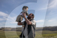Flying high: how a photo of a Syrian father and son led to a new life in Italy.