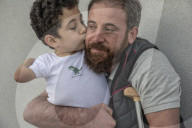 Flying high: how a photo of a Syrian father and son led to a new life in Italy.