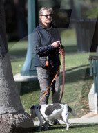 Former James Bond girl Maud Adams cuts a youthful and athletic figure as she enjoys an afternoon dog walk right before her 77th birthday.