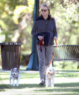 Former James Bond girl Maud Adams cuts a youthful and athletic figure as she enjoys an afternoon dog walk right before her 77th birthday.