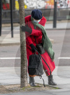 Commuters are blown about by Storm Franklin in London UK