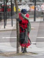 Commuters are blown about by Storm Franklin in London UK