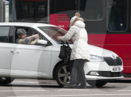 Commuters are blown about by Storm Franklin in London UK