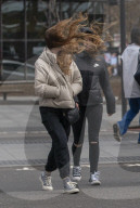 Commuters are blown about by Storm Franklin in London UK