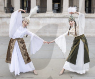 Kyrgyzstan artists in their national dress in Trafalgar Square, London