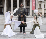 Kyrgyzstan artists in their national dress in Trafalgar Square, London