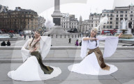 Kyrgyzstan artists in their national dress in Trafalgar Square, London