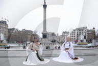 Kyrgyzstan artists in their national dress in Trafalgar Square, London