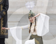 Kyrgyzstan artists in their national dress in Trafalgar Square, London
