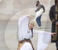 Kyrgyzstan artists in their national dress in Trafalgar Square, London
