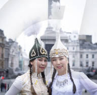 Kyrgyzstan artists in their national dress in Trafalgar Square, London