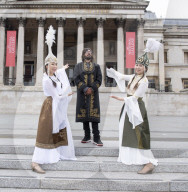 Kyrgyzstan artists in their national dress in Trafalgar Square, London