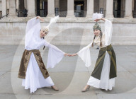 Kyrgyzstan artists in their national dress in Trafalgar Square, London