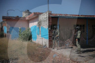 Battle-scarred ghost town bears mute witness to Mexico’s drug wars. The army has reclaimed the village school that became a battlefield but few believe gangs’ bloody reign has ended